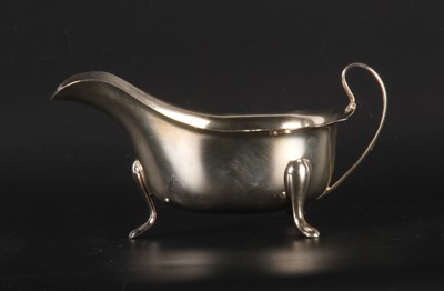Lot 82 - An Elizabeth II silver helmet shaped sauce...
