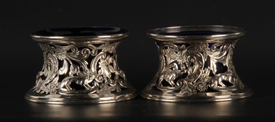 Lot 124 - A pair of Edward VII pierced silver table...