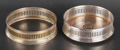 Lot 125 - A pair of Elizabeth II silver wine coasters,...