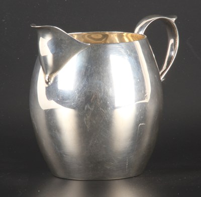 Lot 37 - A George VI silver milk jug, of barrel shape,...