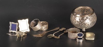 Lot 202 - A collection of silver and white metal items,...