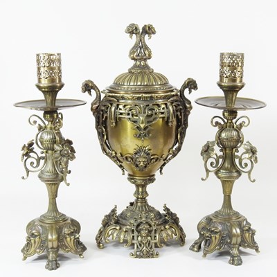Lot 224 - An ornate French bronze three piece garniture,...