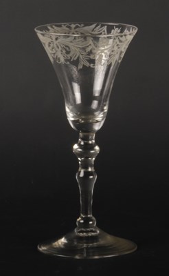 Lot 166 - A wine glass, circa 1740, the etched bell bowl...