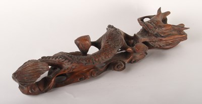 Lot 493 - A Chinese carved wood model of a dragon