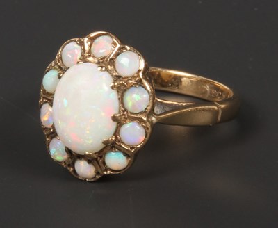 Lot 94 - A 9 carat yellow gold opal cluster ring, size...