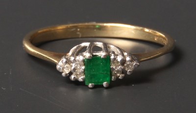 Lot 32 - A 9 carat yellow gold emerald and diamond...