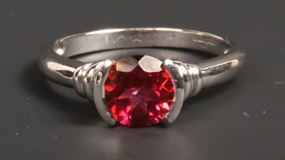 Lot 53 - A 9 carat white gold red topaz solitaire ring,...