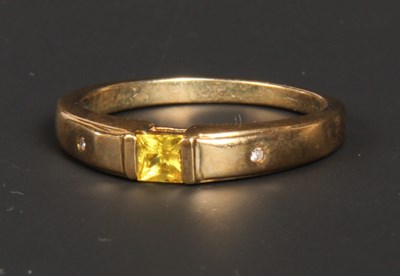 Lot 106 - A 9 carat yellow gold yellow sapphire ring,...