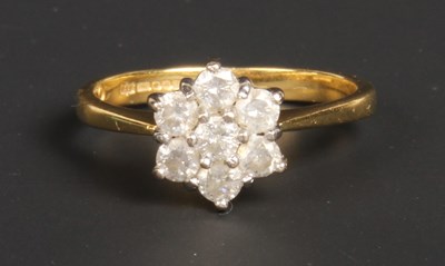 Lot 121 - An 18 carat yellow gold diamond flowerhead...