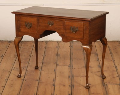 Lot 600 - A George III style walnut lowboy