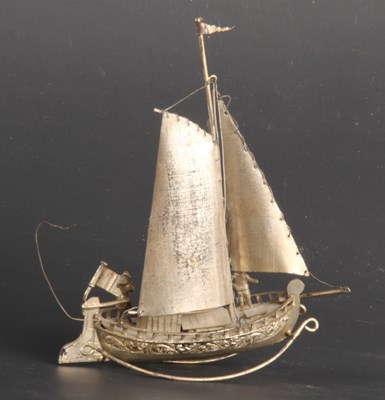 Lot 95 - A silver model of a sailing boat, 51g