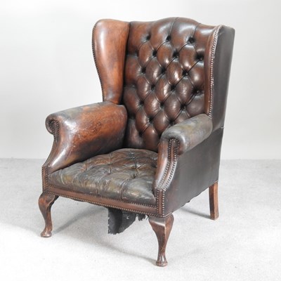 Lot 70 - A mid 20th century brown leather upholstered...
