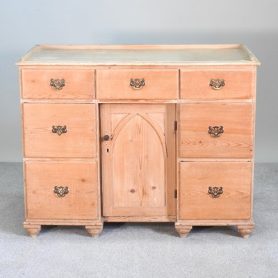 Lot 552 - An antique pine kneehole desk, with an inset top