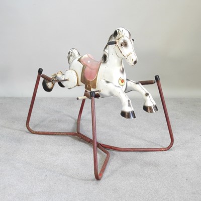 Lot 476 - A vintage tin plate children's rocking horse