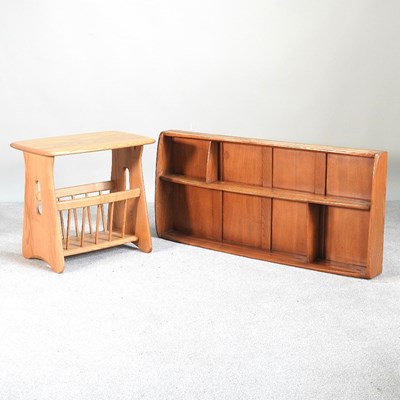 Lot 88 - An Ercol light elm magazine table, 55cm wide,...