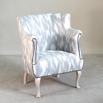 Lot 162 - A 1930s white painted armchair, upholstered in...