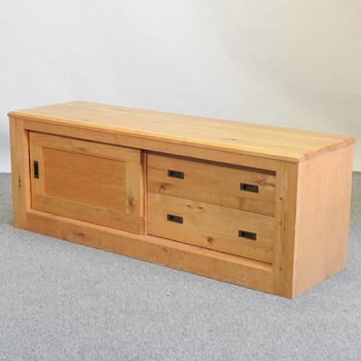 Lot 725 - A modern light oak side cabinet