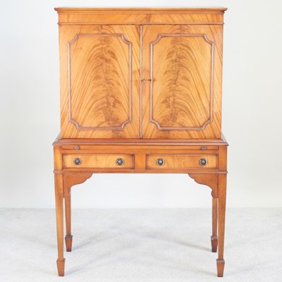 Lot 304 - A modern mahogany drinks cabinet, by Shaws of...