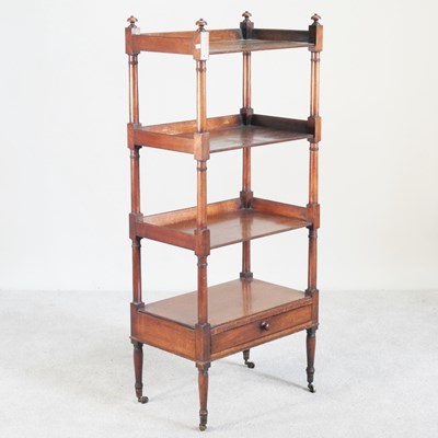 Lot 237 - A Regency mahogany four tier whatnot, united...