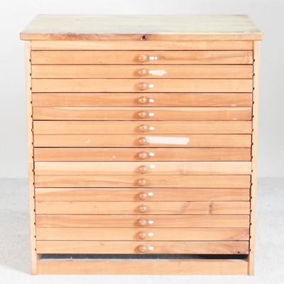 Lot 201 - A pine plan chest, containing fifteen narrow...
