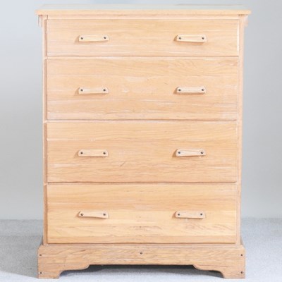 Lot 262 - A mid 20th century light oak chest of drawers