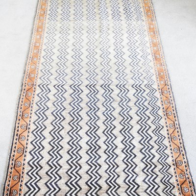 Lot 101 - A Persian runner, with rows of zig zag designs,...