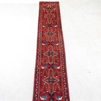 Lot 46 - A belouch runner, with a row of central...