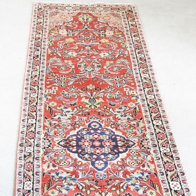 Lot 290 - A sarouk mahal runner, with scrolling foliate...