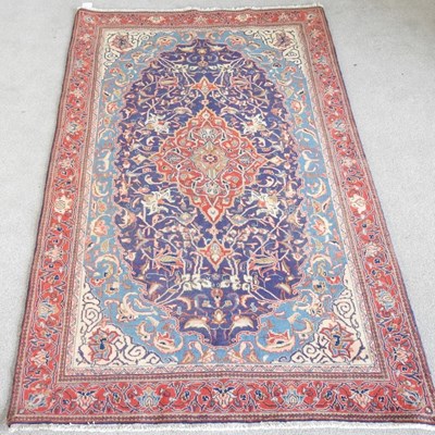 Lot 267 - A Persian sarouk rug, with scrolling foliate...