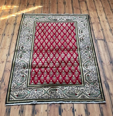 Lot 727 - A Persian Arak rug, on a red ground, 200 x 140cm