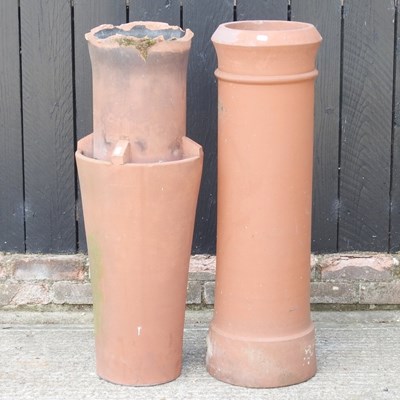 Lot 40 - A chimney pot, 92cm high, together with...