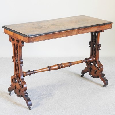 Lot 562 - A Victorian marquetry stretcher table, on fret...
