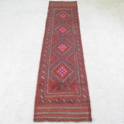 Lot 275 - A Persian runner, with a row of four central...