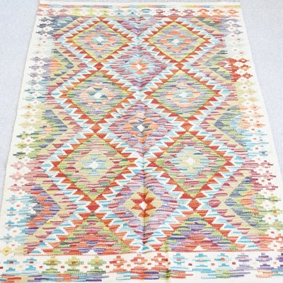 Lot 119 - A kilim rug, with all over coloured diamonds,...