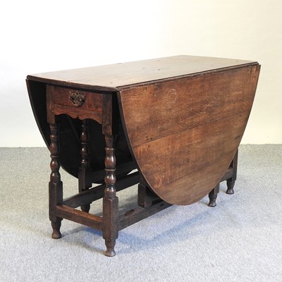 Lot 602 - An 18th century oak gateleg dining table