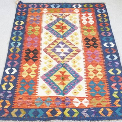 Lot 464 - A kilim rug, with three central coloured...