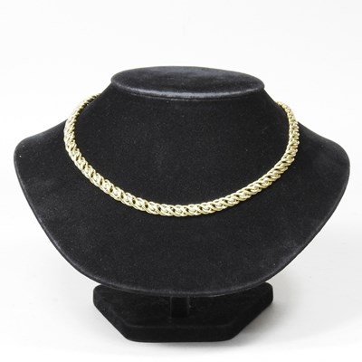 Lot 324 - An 18 carat gold necklace, of twisted link...