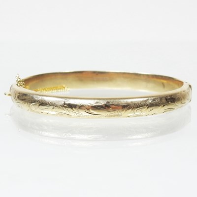 Lot 190 - A 9 carat gold bangle, of hinged design,...