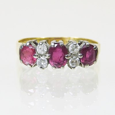 Lot 106 - A ruby and diamond dress ring, set with three...