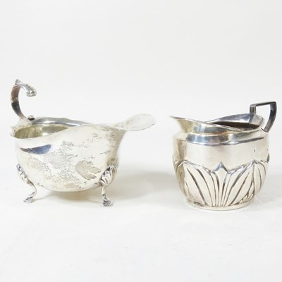 Lot 158 - An Edwardian silver cream jug, of helmet shape,...