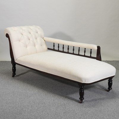 Lot 598 - A Victorian cream upholstered chaise longue