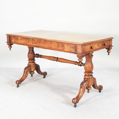 Lot 25 - A Victorian walnut library table, on splayed...