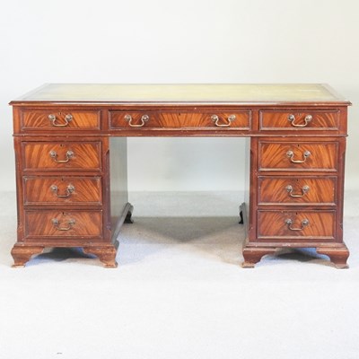 Lot 283 - A large reproduction mahogany desk, with an...