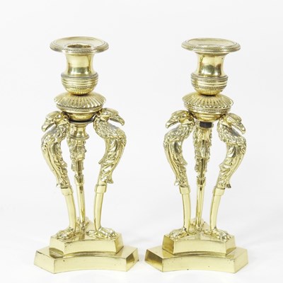 Lot 222 - A pair of ornate French brass candlesticks,...