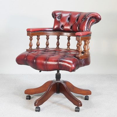 Lot 18 - A leather upholstered revolving swivel desk chair