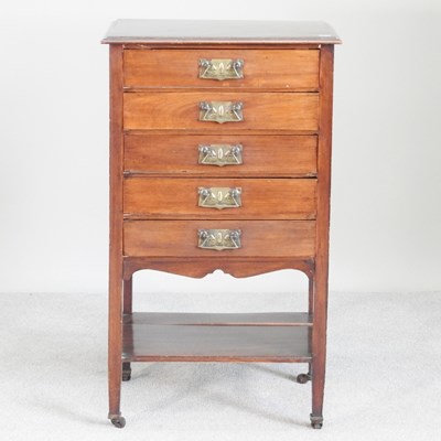 Lot 235 - An Edwardian music cabinet, containing five...