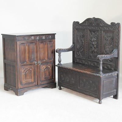 Lot 509 - An early 20th century heavily carved dark oak...