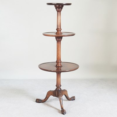 Lot 115 - A George III style mahogany three tier dumb...