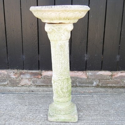Lot 99 - A cast stone garden bird bath, 80cm high