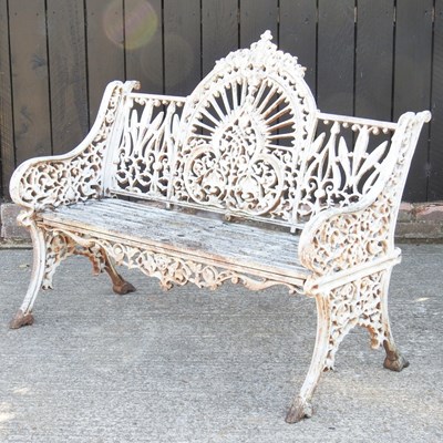 Lot 94 - An ornate white painted cast iron garden bench,...
